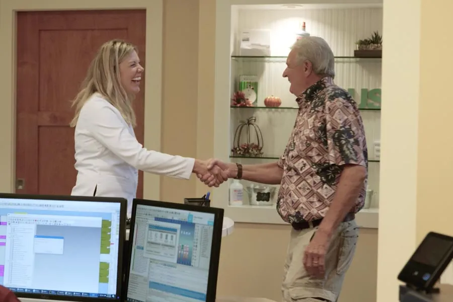 A Grandville Dental clinician greeting a patient in the practice