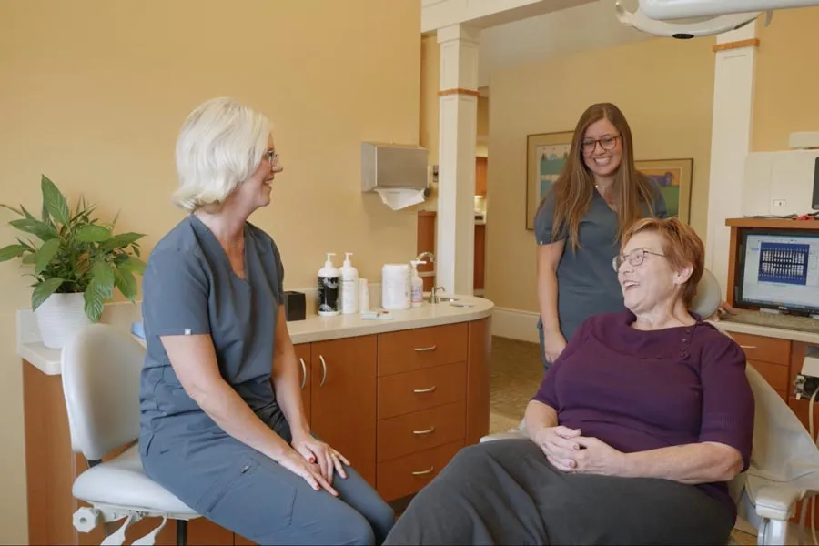 A patient receiving attentive consultation in a Grandville Dental treatment room