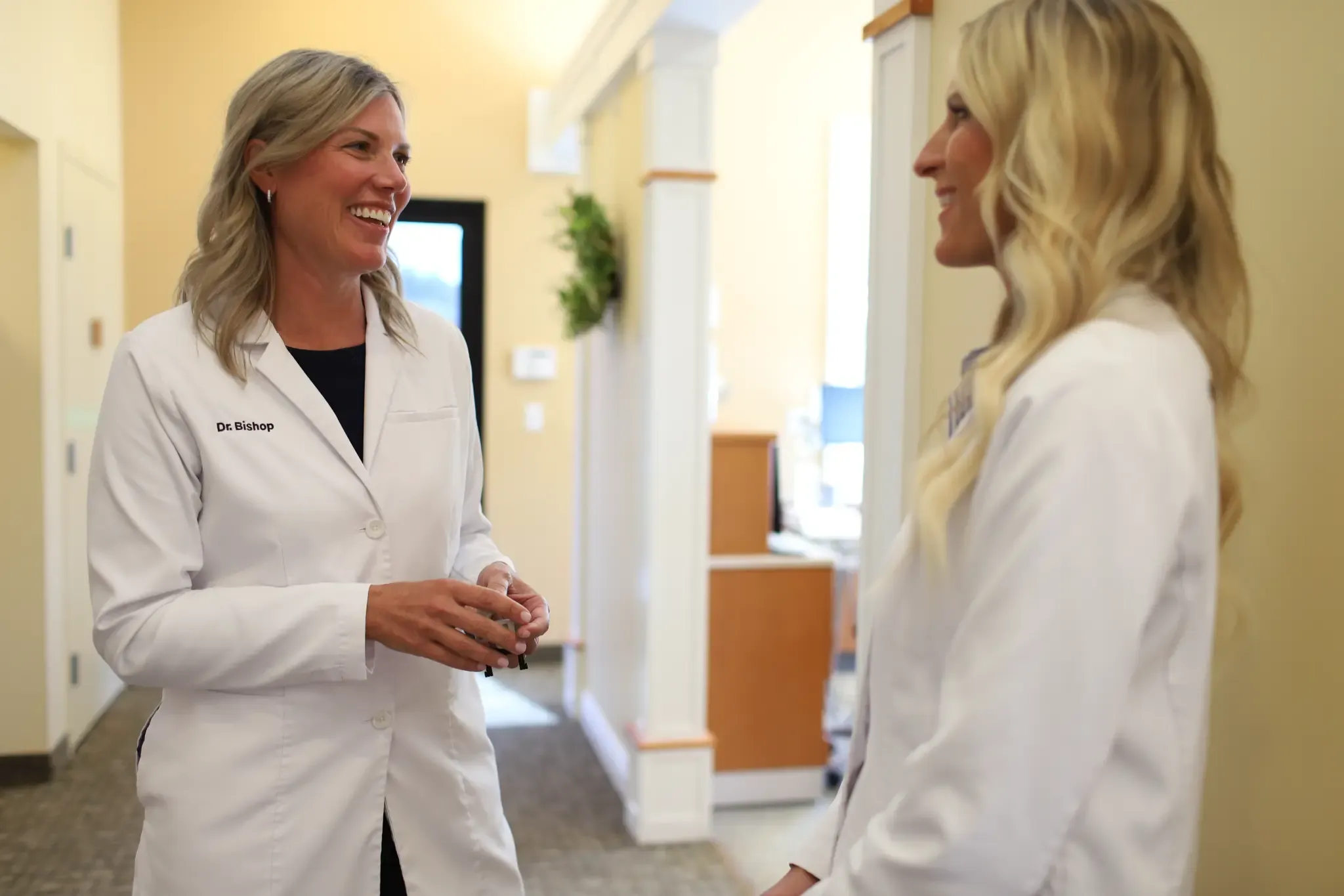 Dr. Larissa Bishop and Dr. Rebecca Vander Baan speaking together at Grandville Dental