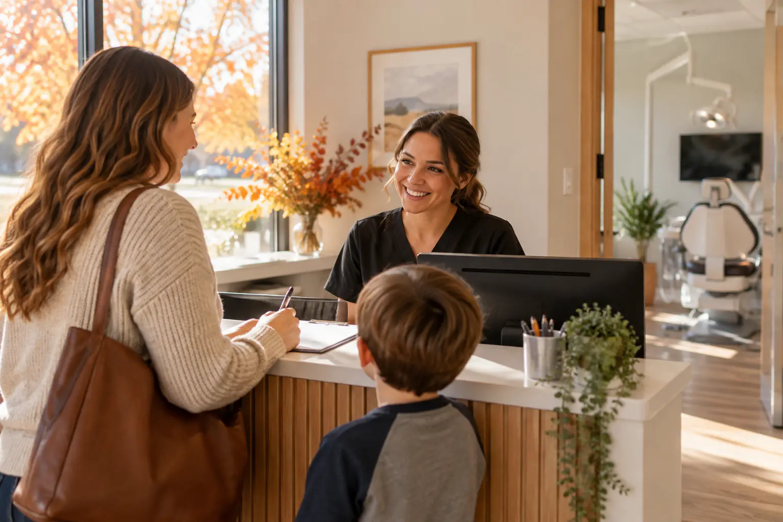 Family reviewing dental insurance benefits before the year ends in Grandville, MI