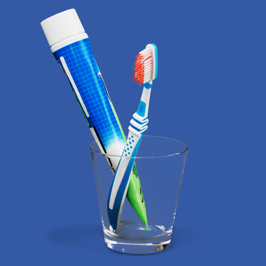 Toothbrush And Toothpaste In Cup